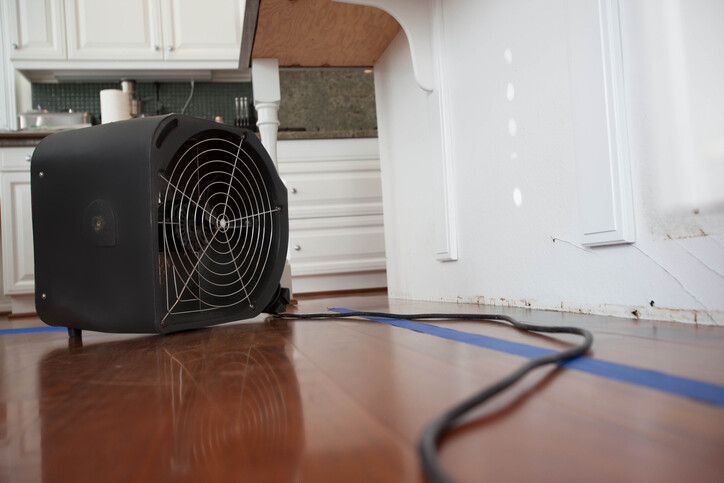 Water damage from appliance leak by 90 Degrees Restoration